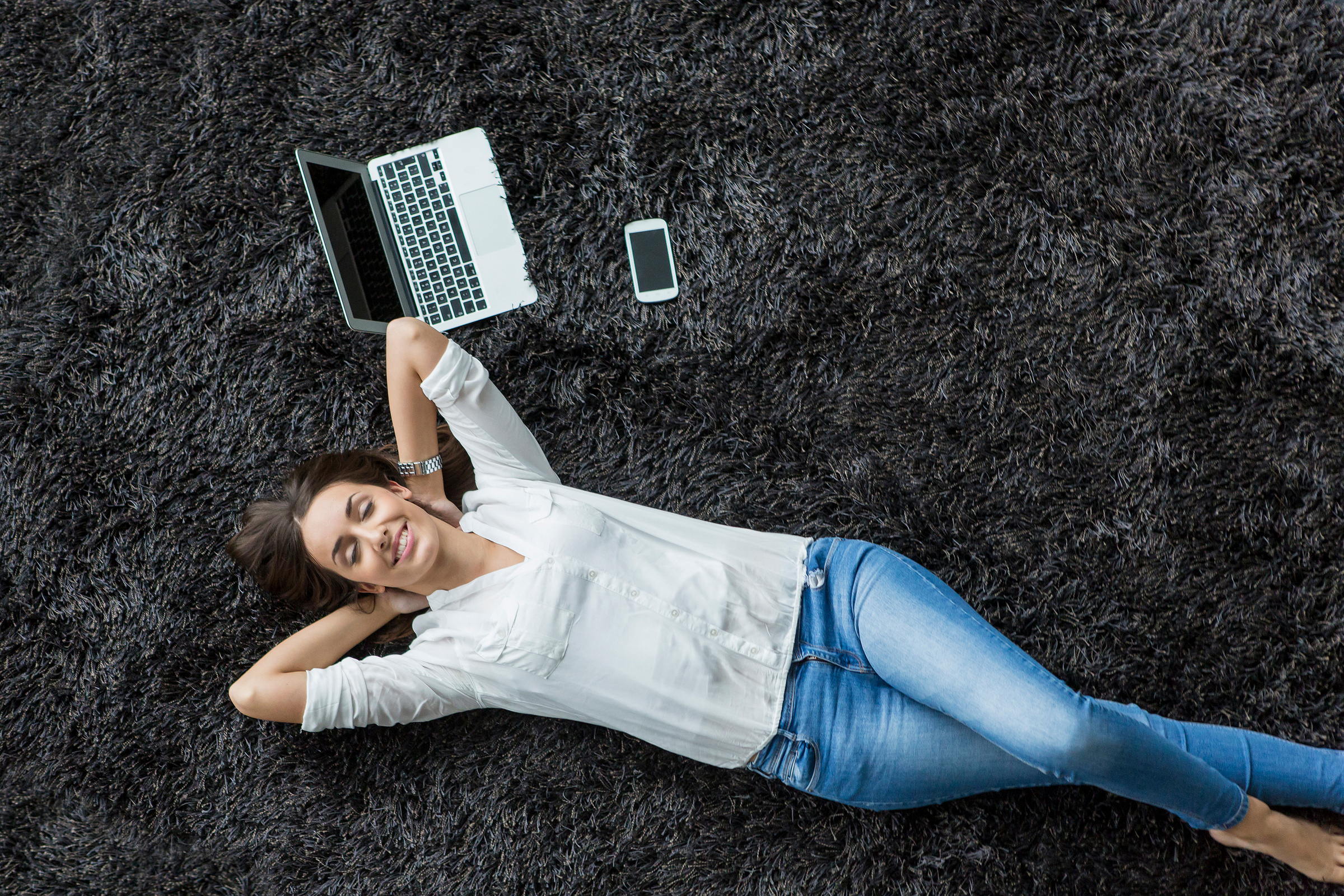 Young Woman Relaxing on the Carpet
